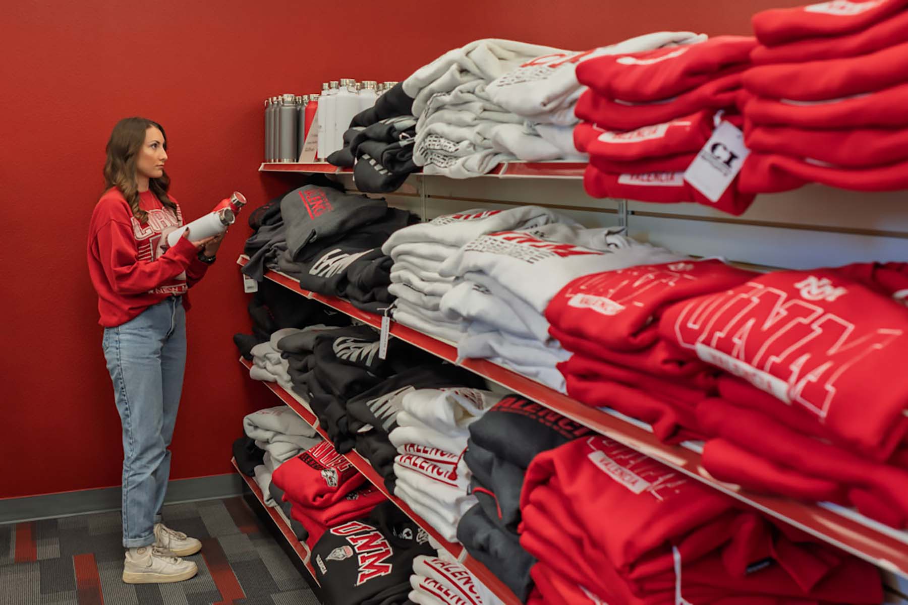 UNM-Valencia Bookstore interior with apparel and merchandise