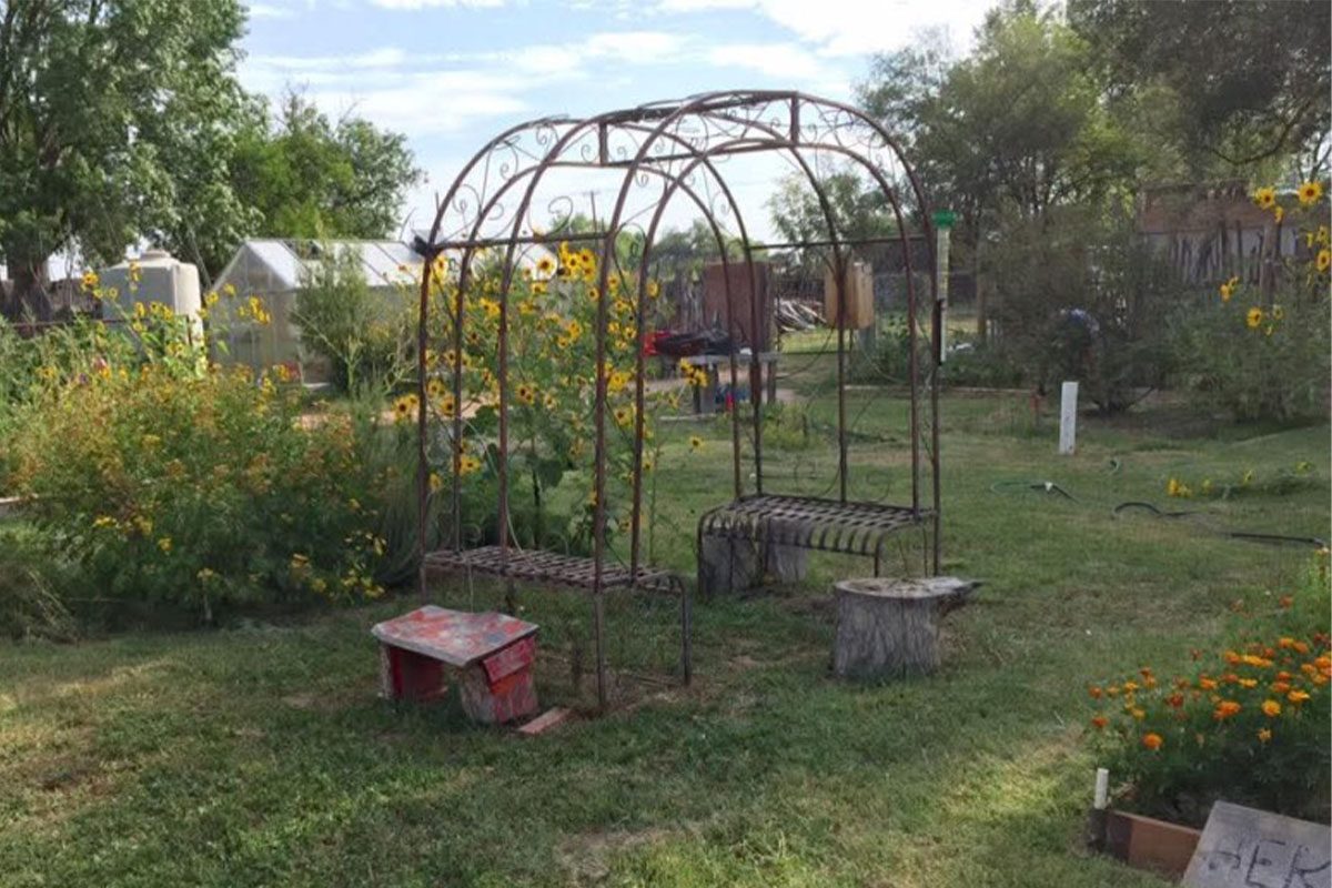 Members of the historic Tomé Community Garden gathered together
